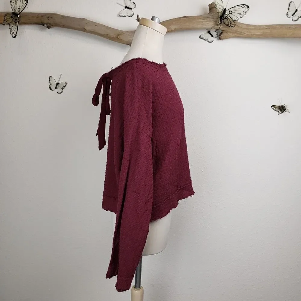 Free people frayed hem bell sleeve maroon top